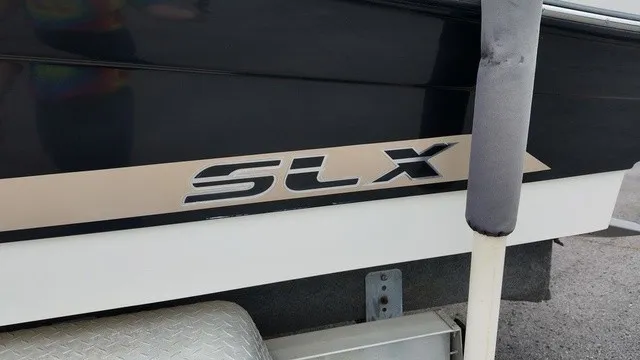 Slide: The Image of Close-up of the "SLX" lettering on a boat hull. - 10