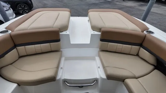 Slide: The Image of The 2015 Sea Ray SLX 250 features a luxurious, beige-upholstered seating arrangement in the bow area. - 31