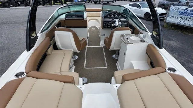 Slide: The Image of Interior view of a 2015 Sea Ray SLX 250 boat with beige and brown seating. - 15