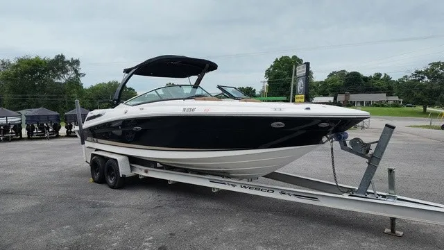 Slide: The Image of A 2015 Sea Ray SLX 250 boat on a trailer, ready for transport. - 7