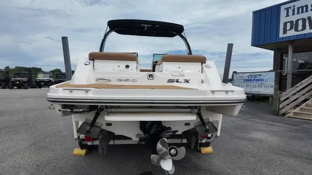 Slide: The Image of The image shows a 2015 Sea Ray SLX 250 boat parked on a lot. - 4