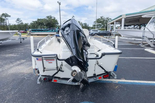 Slide: The Image of A 2012 Boston Whaler 150 Montawk on a trailer in a parking lot. - 5