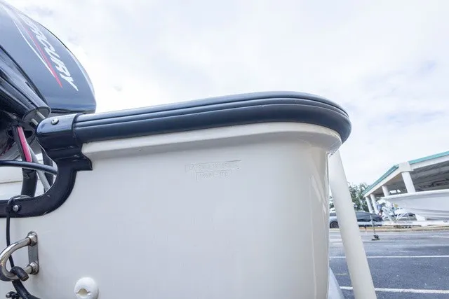 Slide: The Image of Close-up of the stern of a 2012 Boston Whaler 150 Montawk with an outboard motor. - 4