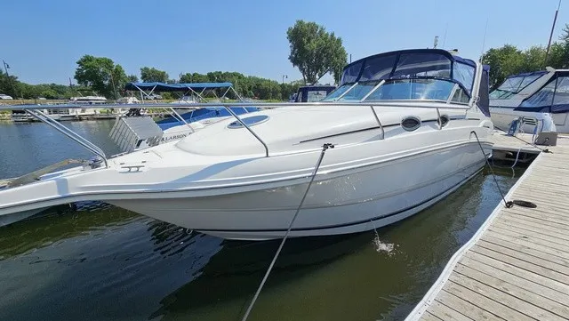 Slide: The Image of A white 2001 Mustang 3200 Sport Cruiser is docked in the water. - 4