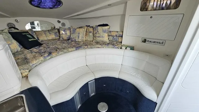 Slide: The Image of Interior of a 2001 Mustang 3200 Sport Cruiser with white leather and patterned cushions. - 15