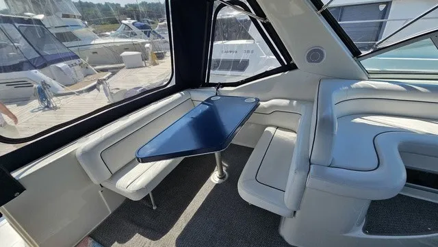 Slide: The Image of Interior of a 2001 Mustang 3200 Sport Cruiser with blue and white seating. - 6