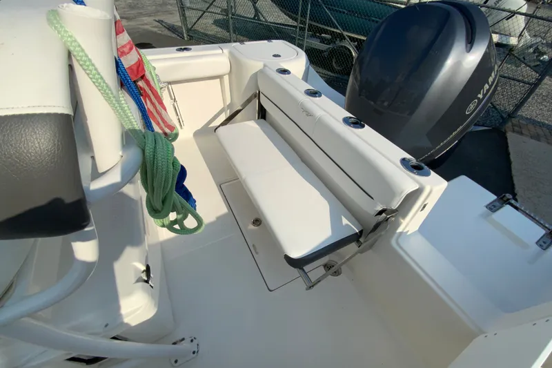 Slide: The Image of 2015 Tidewater 230 CC Adventure boat interior with seating and Yamaha engine. - 15