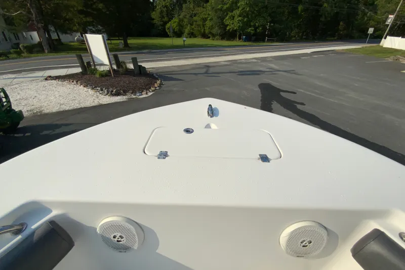 Slide: The Image of Bow view of 2015 Tidewater 230 CC Adventure boat in a parking area. - 21