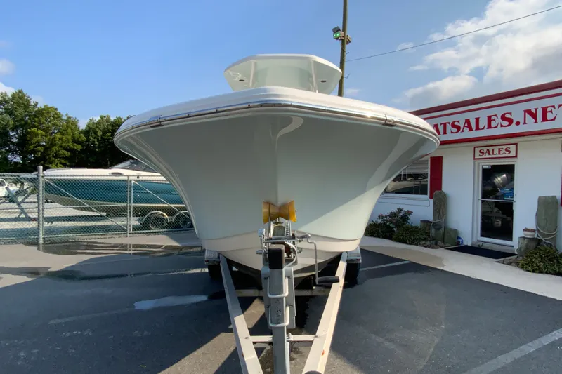 Slide: The Image of 2015 Tidewater 230 CC Adventure boat on trailer at dealership. - 4