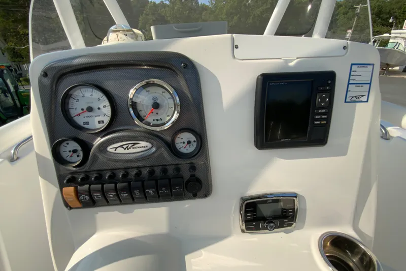 Slide: The Image of Dashboard of 2015 Tidewater 230 CC Adventure boat with gauges and Garmin GPS. - 13