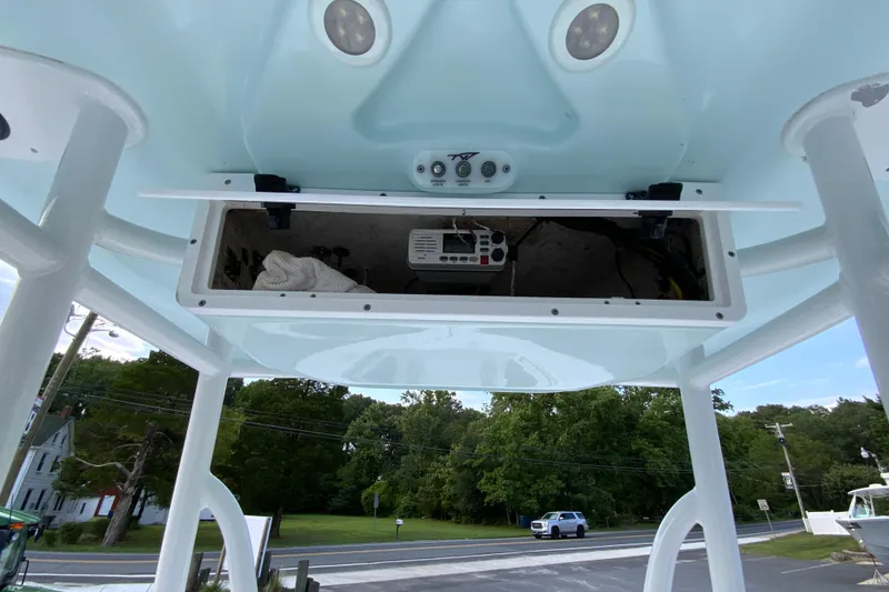 Slide: The Image of 2015 Tidewater 230 CC Adventure boat console with open storage compartment. - 28