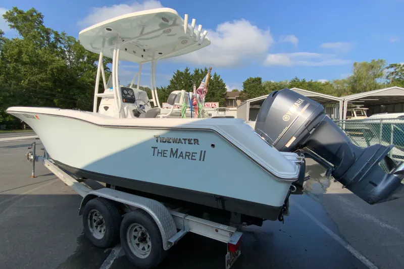 Slide: The Image of 2015 Tidewater 230 CC Adventure boat on trailer, featuring Yamaha outboard motor. - 7