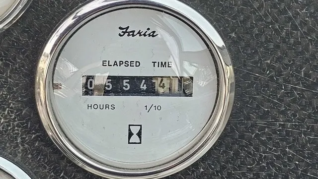 Slide: The Image of A round hour meter displays 554.1 hours. It has a silver rim. - 23