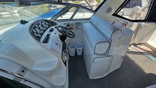 Slide: The Image of The image shows the cockpit of a 2001 Mustang 3200 Sport Cruiser with a helm and seating area. - 11