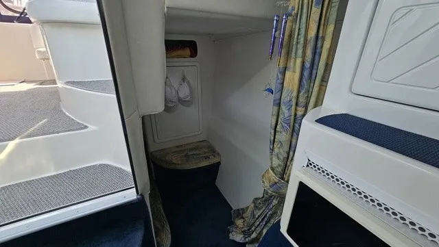 Slide: The Image of Interior of a 2001 Mustang 3200 Sport Cruiser with stairs and curtain. - 19