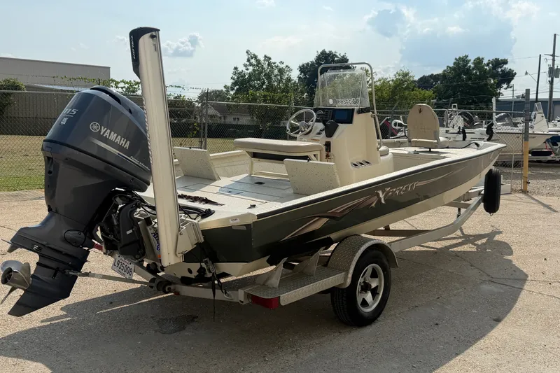 Slide: The Image of 2013 Xpress H20B Bay boat with Yamaha outboard motor on trailer. - 5
