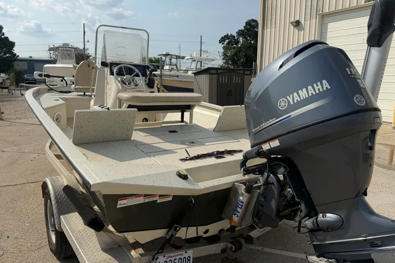 Slide: The Image of 2013 Xpress H20B Bay boat with Yamaha outboard motor on a trailer. - 15