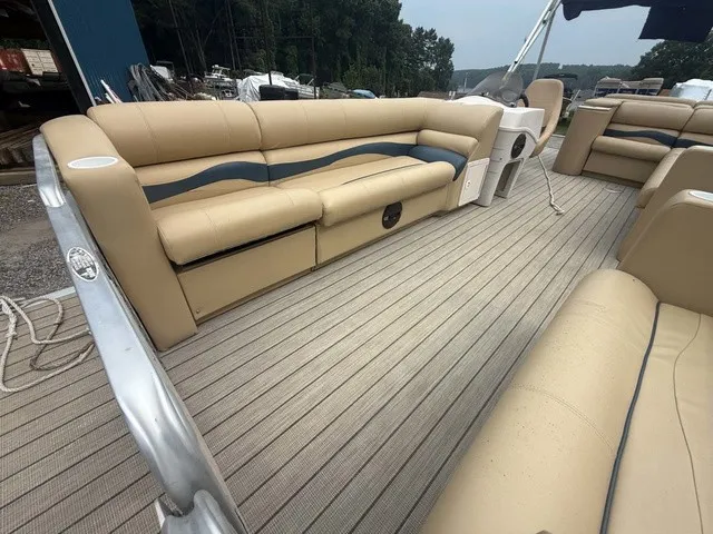 Slide: The Image of The image shows the interior of a 2002 Harris Sunliner 220 with beige seating and wood flooring. - 8