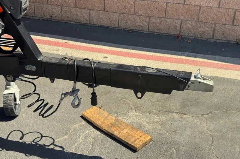 Slide: The Image of Trailer hitch of a 2018 Malibu Wakesetter 22 MXZ on pavement. - 35