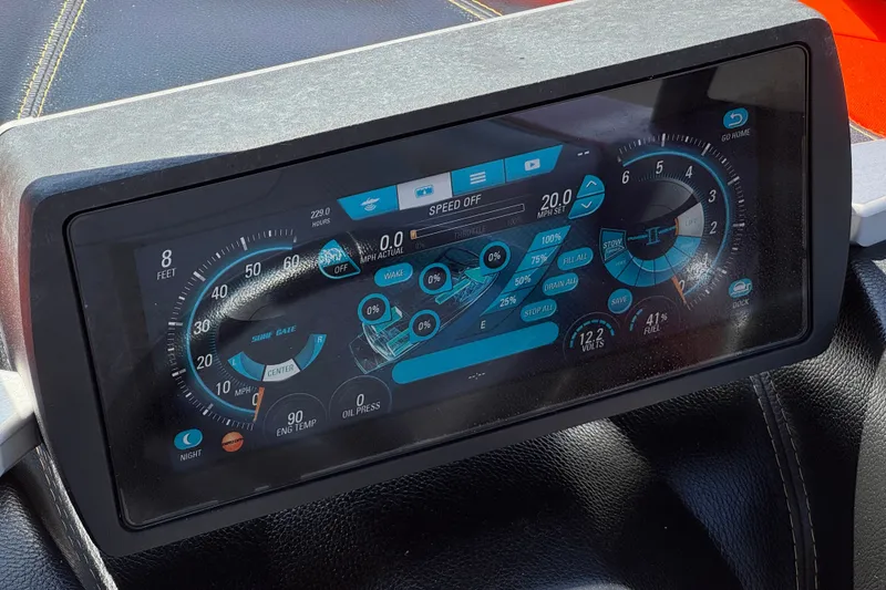 Slide: The Image of Dashboard display of a 2018 Malibu Wakesetter 22 MXZ boat, showing speed and engine data. - 32