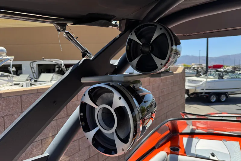 Slide: The Image of Speakers on a 2018 Malibu Wakesetter 22 MXZ boat, docked outdoors. - 18