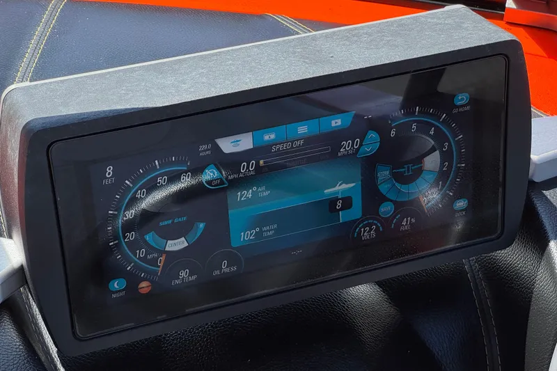 Slide: The Image of Dashboard display of a 2018 Malibu Wakesetter 22 MXZ boat, showing speed and temperature gauges. - 31