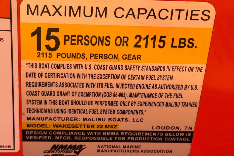 Slide: The Image of 2018 Malibu Wakesetter 22 MXZ capacity label: 15 persons or 2115 lbs, safety compliance. - 36