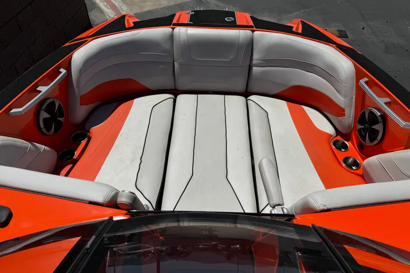 Slide: The Image of Interior of 2018 Malibu Wakesetter 22 MXZ boat with orange and white seating. - 13