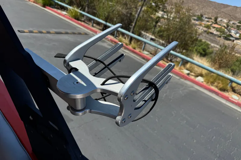 Slide: The Image of Wakeboard rack on 2018 Malibu Wakesetter 22 MXZ, parked on a sunny day. - 17
