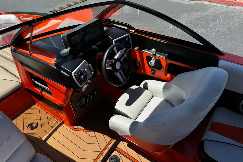 Slide: The Image of 2018 Malibu Wakesetter 22 MXZ boat interior with modern dashboard and steering wheel. - 28