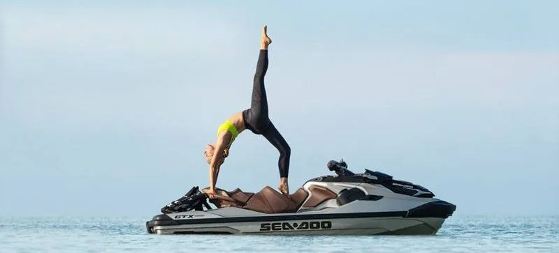Slide: The Image of A person doing yoga on a 2019 Sea-Doo GTX Limited 300 in the water. - 3