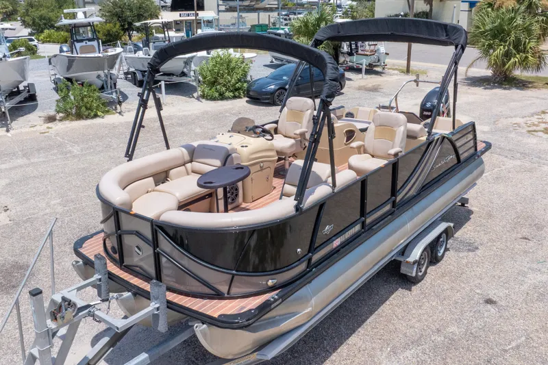 Slide: The Image of 2017 South Bay 523SL pontoon boat on trailer, featuring spacious seating and sleek design. - 5