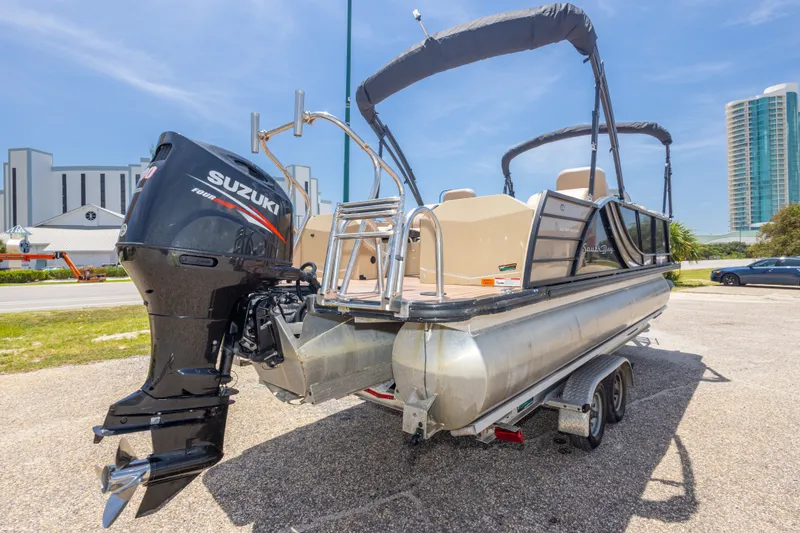 Slide: The Image of 2017 South Bay 523SL pontoon boat with Suzuki outboard motor on trailer. - 13