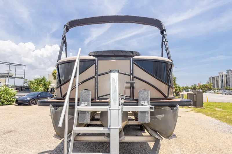 Slide: The Image of 2017 South Bay 523SL pontoon boat on trailer under clear blue sky. - 16
