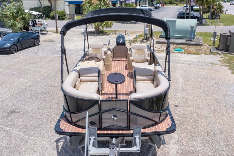 Slide: The Image of 2017 South Bay 523SL pontoon boat with spacious seating and sleek design, parked outdoors. - 12