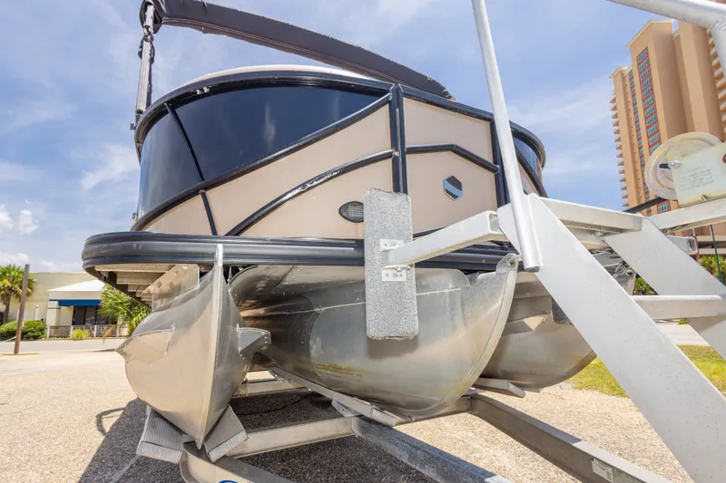 Slide: The Image of 2017 South Bay 523SL pontoon boat on trailer, sunny day, urban background. - 17