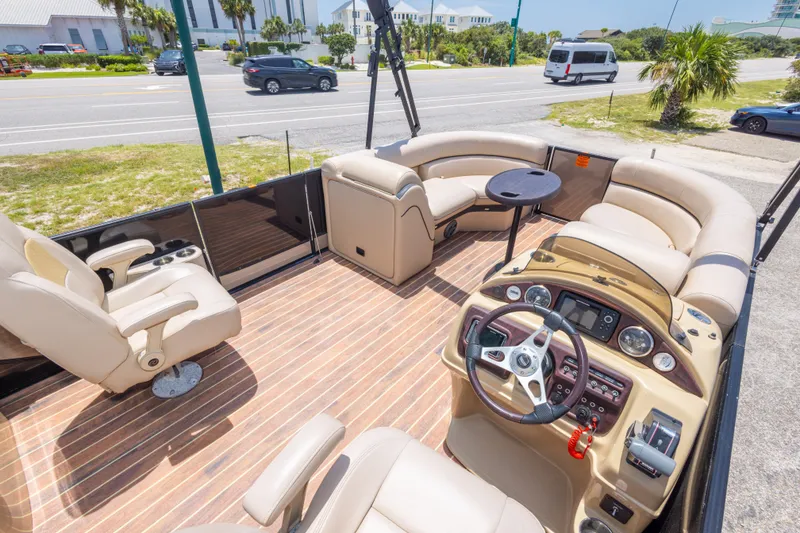 Slide: The Image of Luxurious 2017 South Bay 523SL pontoon boat interior with plush seating and modern dashboard. - 25