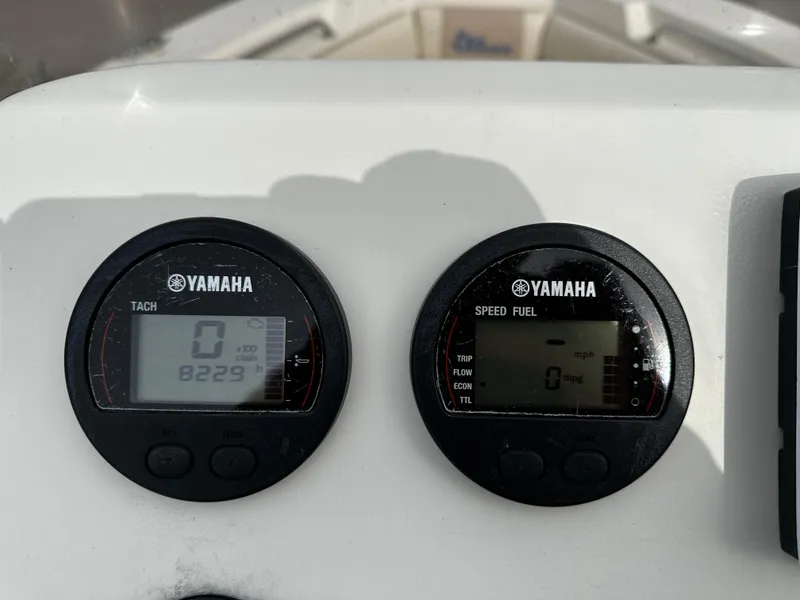 Slide: The Image of Two Yamaha gauges display tachometer and speed/fuel information on a boat panel. - 40