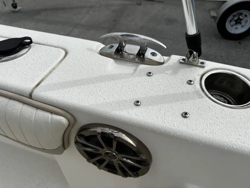 Slide: The Image of Close-up of a boat deck with speaker, cup holder, and stainless steel fittings. - 33