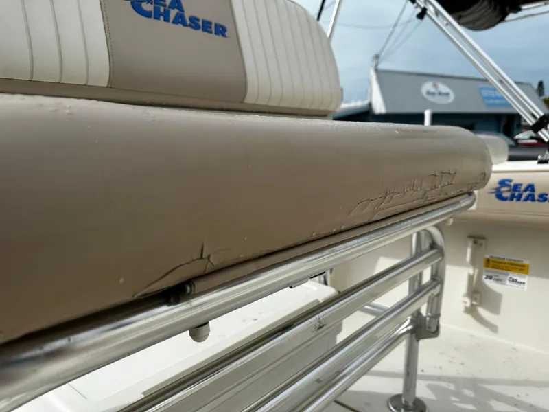 Slide: The Image of Close-up of a Sea Chaser 20 HFC boat seat with visible wear and tear. - 35