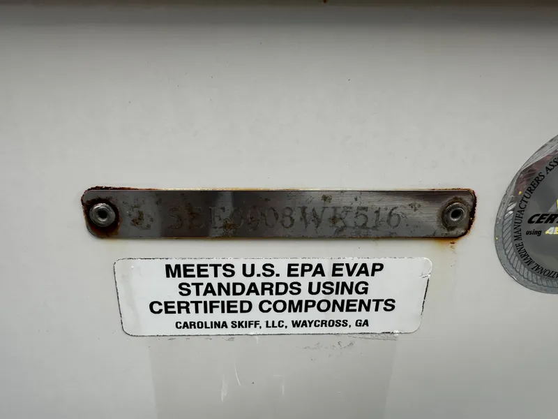 Slide: The Image of A plaque on a boat indicates compliance with EPA standards using certified components. - 12