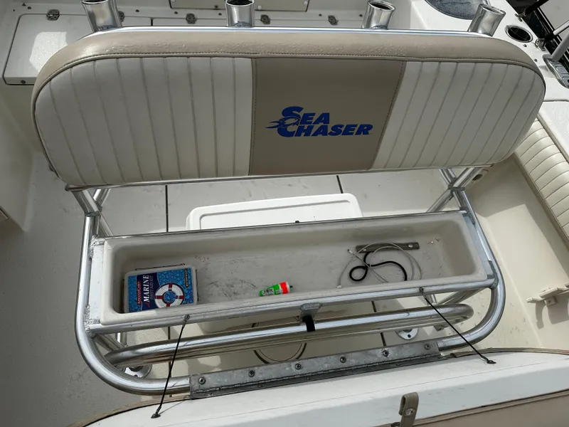 Slide: The Image of The rear bench seat of a Sea Chaser 20 HFC boat with storage underneath. - 37