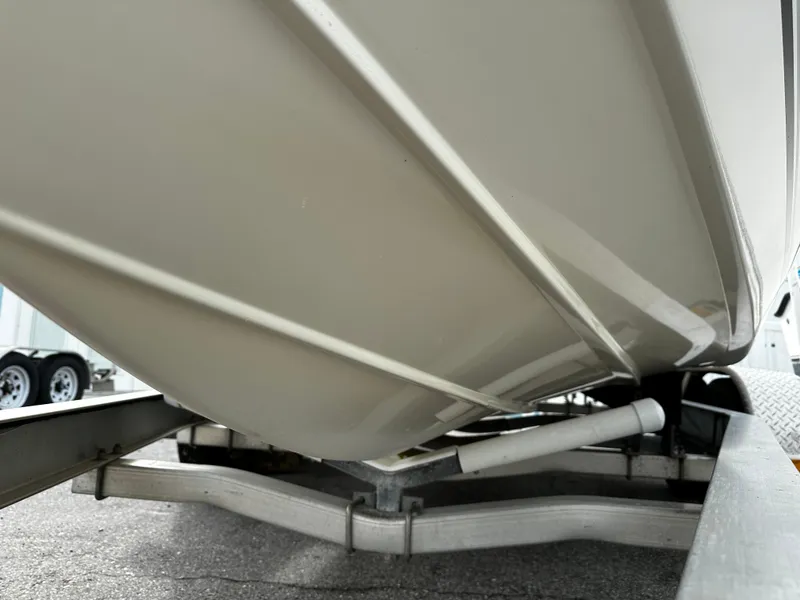 Slide: The Image of The hull of a 2016 Sea Chaser 20 HFC on a trailer, ready for transport. - 7
