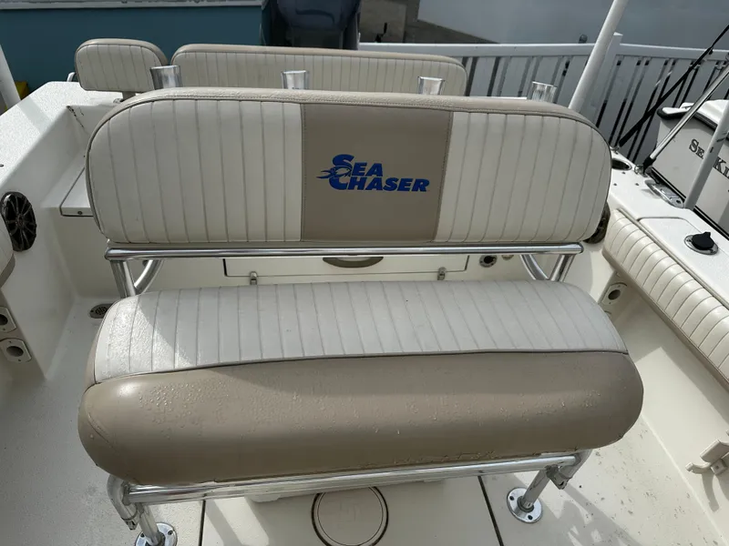 Slide: The Image of A cushioned bench seat with the Sea Chaser logo on a boat. - 34