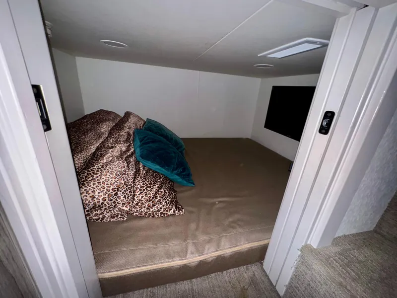 Slide: The Image of Cozy sleeping area in 2021 Adonia Solace Trip #16 RV with leopard print bedding. - 6