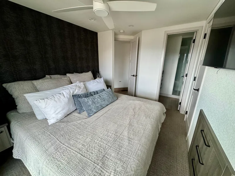 Slide: The Image of Modern bedroom in Adonia Solace Trip #16, 2021 model, featuring cozy bedding and sleek decor. - 10