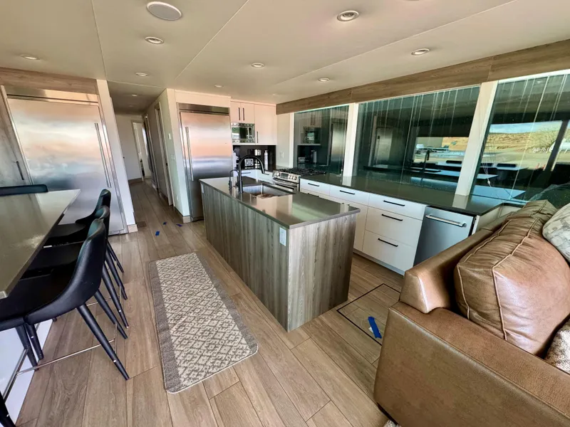 Slide: The Image of Modern kitchen interior in Adonia Solace Trip #16, 2021, featuring sleek design and spacious layout. - 14