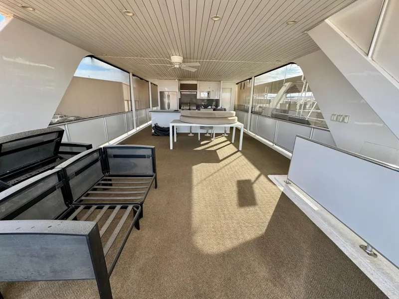 Slide: The Image of Spacious upper deck of 2021 Adonia Solace Trip #16 yacht with seating and table. - 23