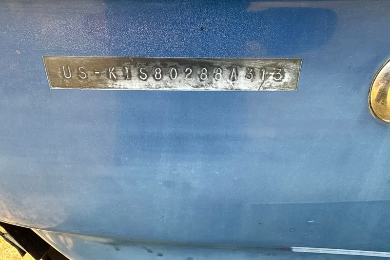 Slide: The Image of 2013 Crownline 21 SS boat hull identification number on blue surface. - 3