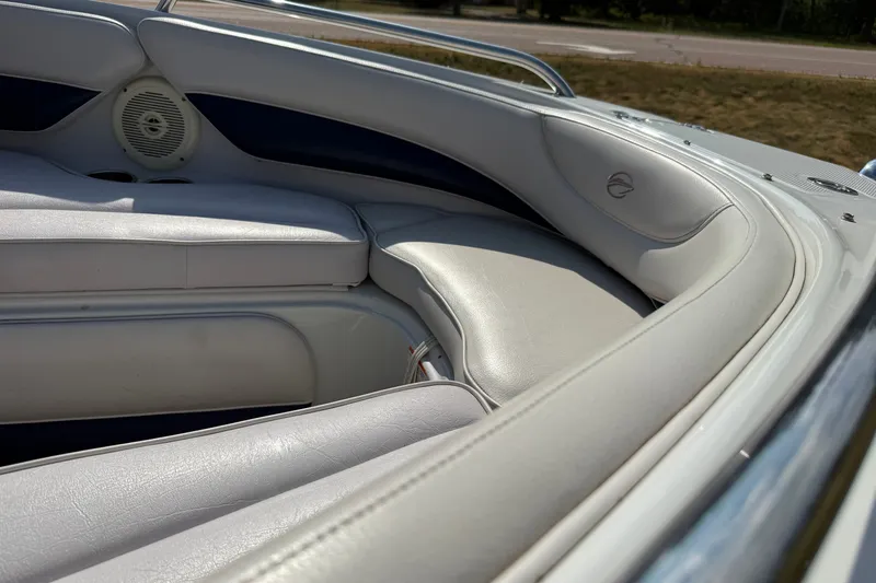 Slide: The Image of Interior seating of a 2013 Crownline 21 SS boat, featuring white leather upholstery. - 28